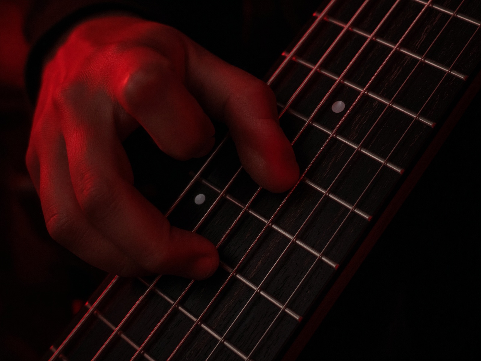 Left hand forming a drop-tuned power chord